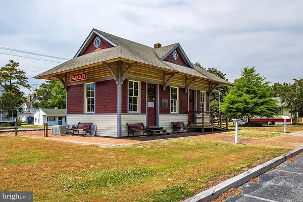 a view of a house with swimming pool and sitting area