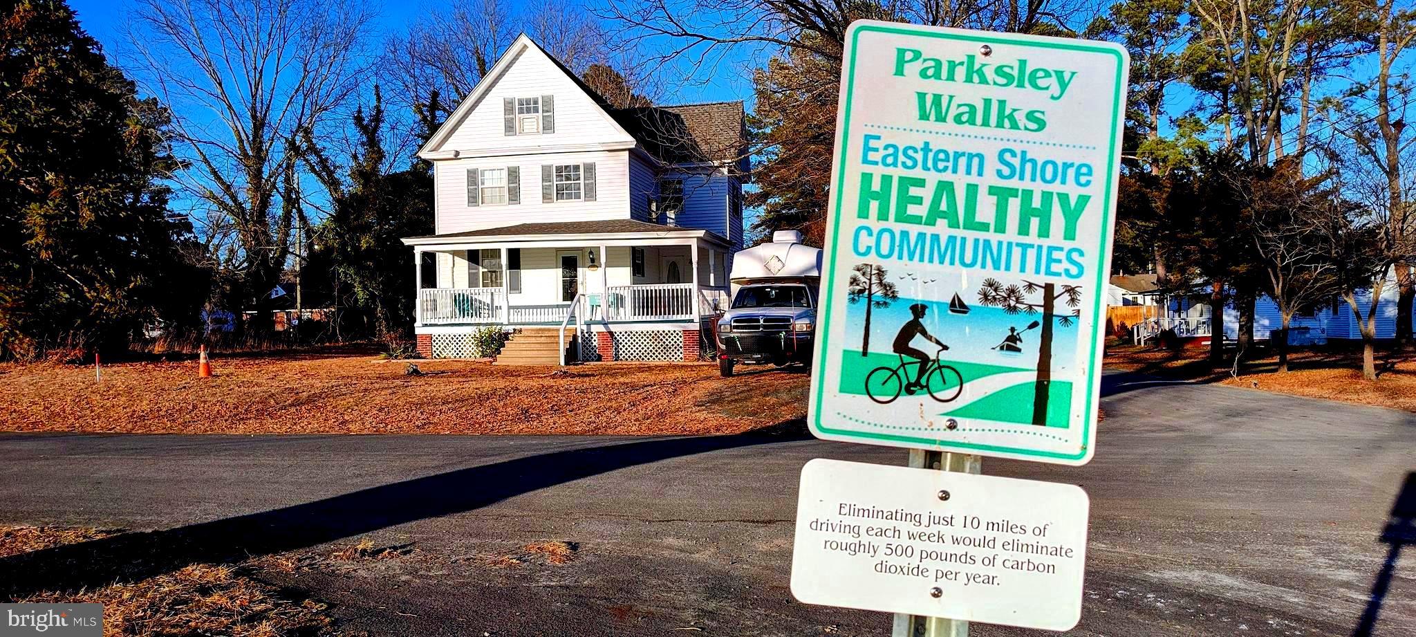 24171 Adelaide Street Parksley, VA 23421 - Photo 4 of 40 a view of a street with sign board