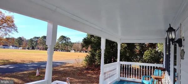 a view of a room with yard from balcony