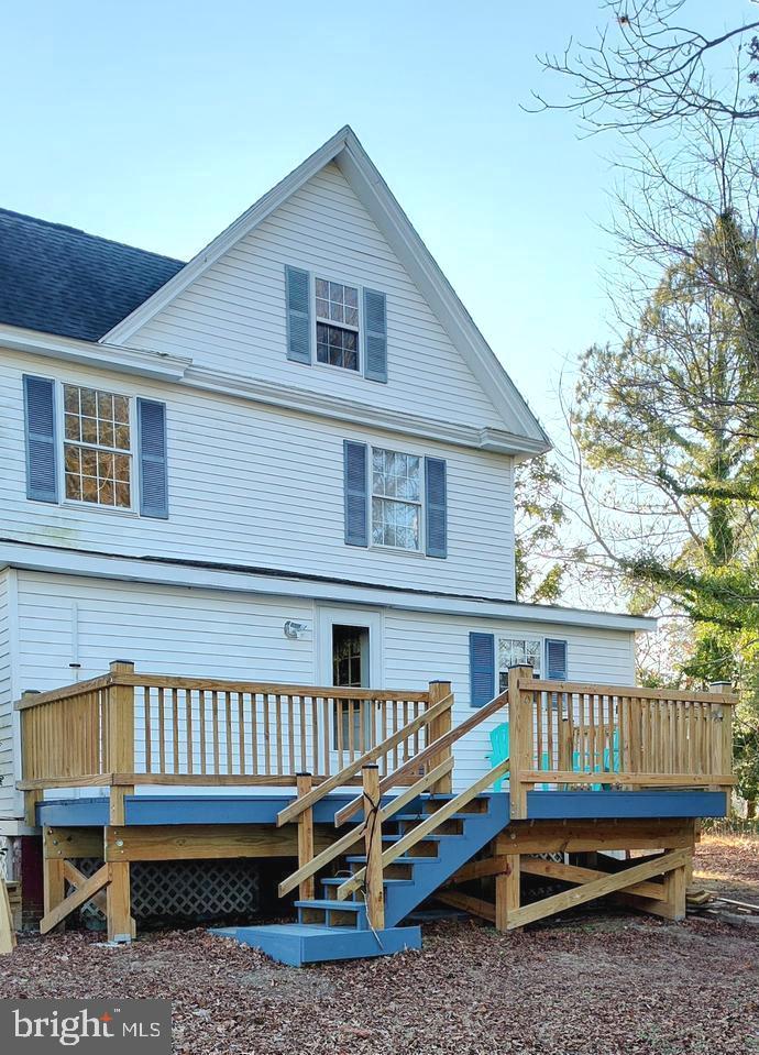 24171 Adelaide Street Parksley, VA 23421 - Photo 6 of 40 a view of a house with a yard and deck