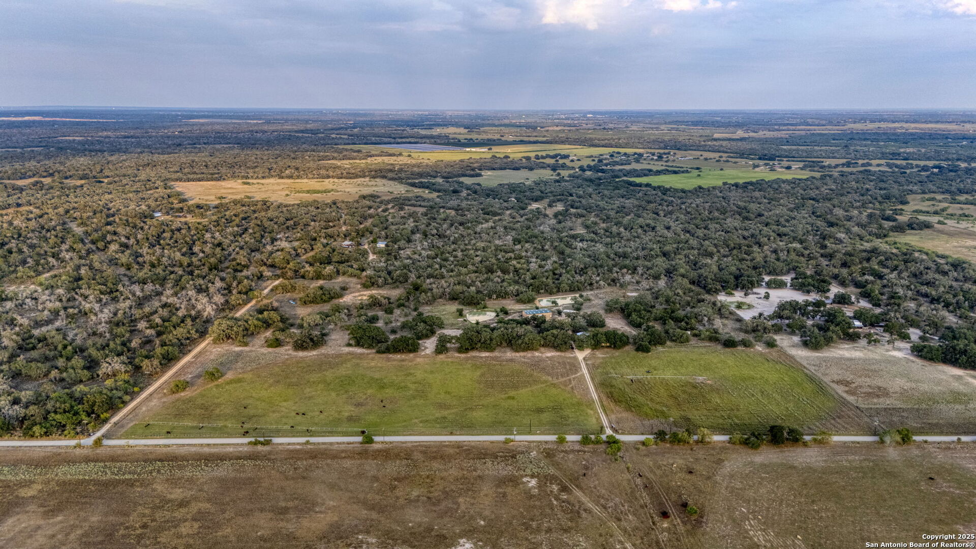 a view of a pathway with a field
