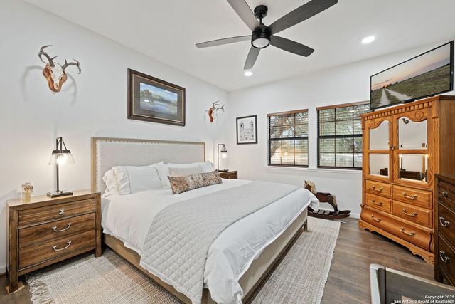 a bedroom with a large bed and a window