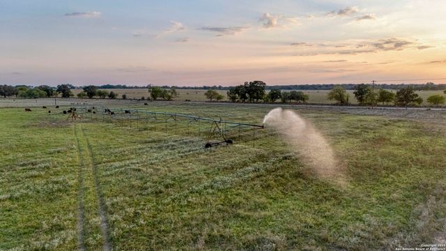 a view of a lake with a yard