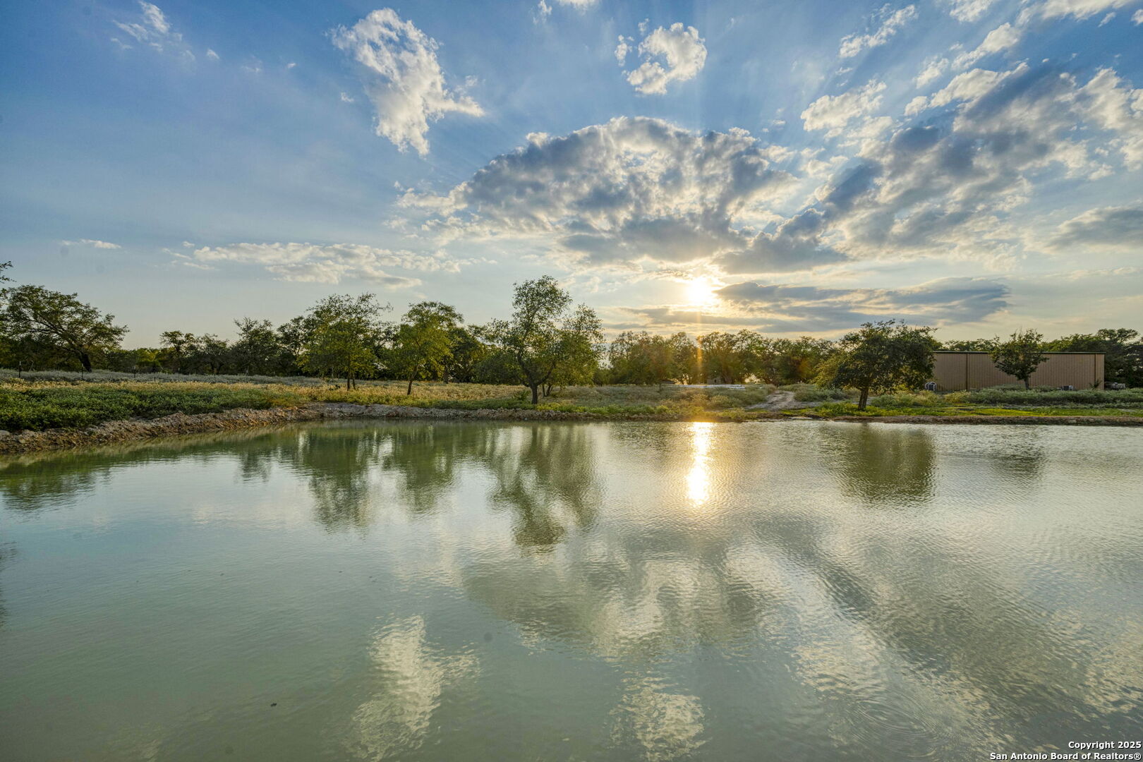 2605 Schuttig Road Pleasanton, TX 78064 - Photo 31 of 35 a view of a lake with a city