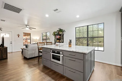 a view of living room with furniture and flat screen tv