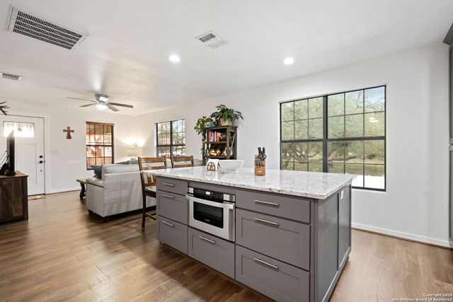 a view of living room with furniture and flat screen tv