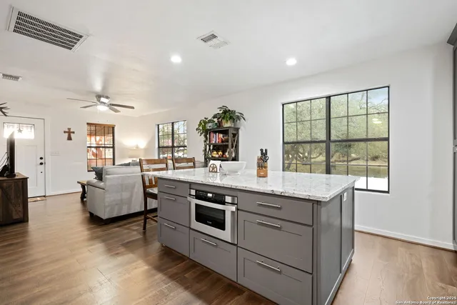 a view of living room with furniture and flat screen tv