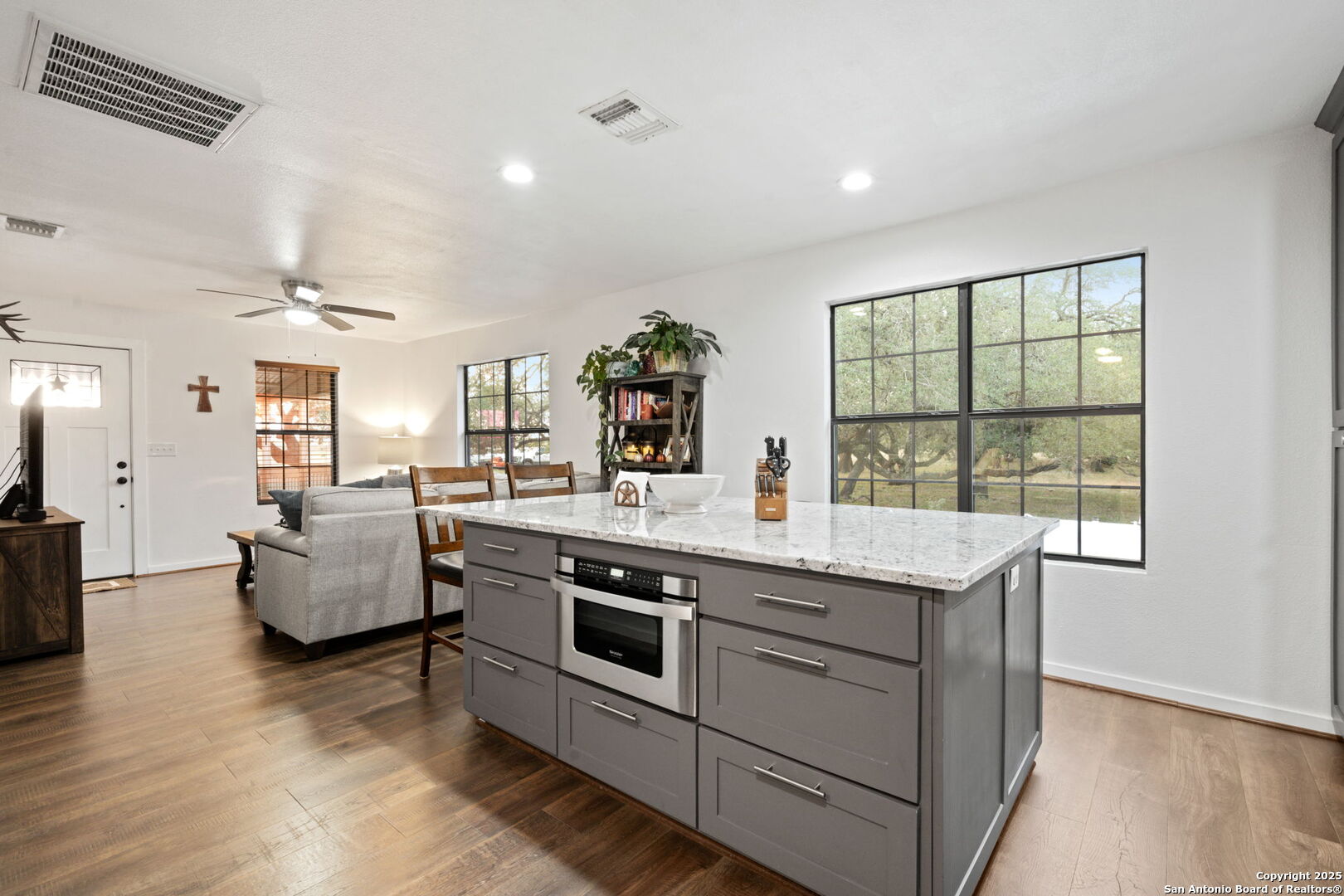 2605 Schuttig Road Pleasanton, TX 78064 - Photo 8 of 35 a view of living room with furniture and flat screen tv