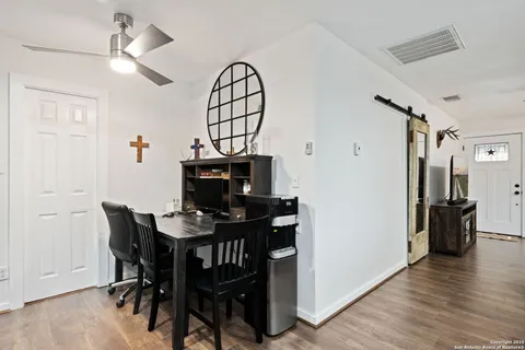 a view of a livingroom with furniture and wooden floor