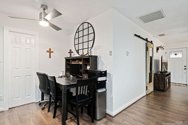 a view of a livingroom with furniture and wooden floor