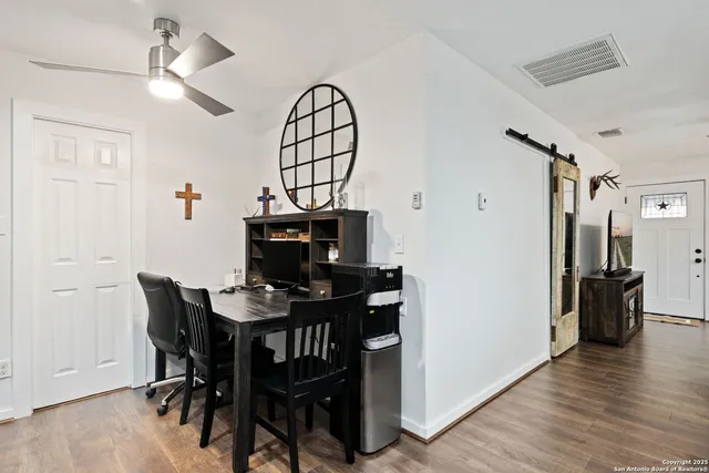 a view of a livingroom with furniture and wooden floor