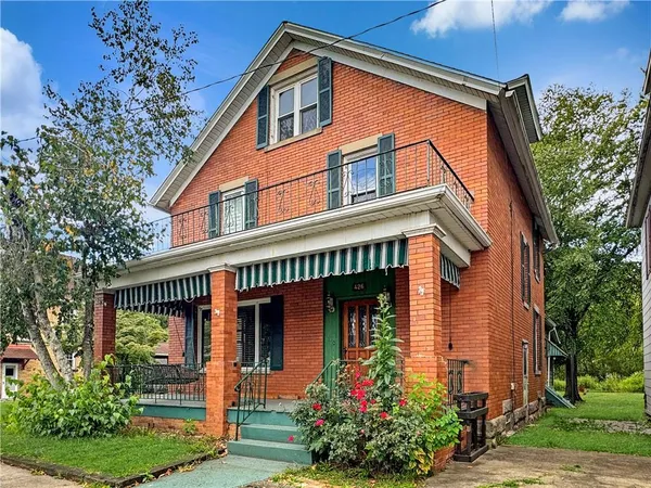 front view of house with a small yard