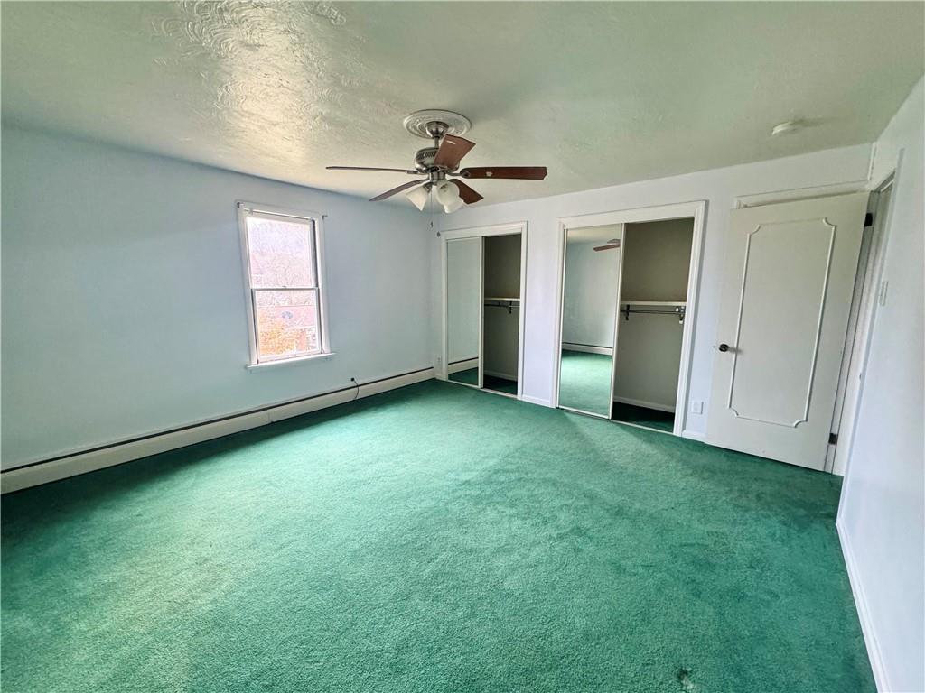 426 Beaver Street Wampum, PA 16157 - Photo 15 of 23 an empty room with windows and cabinet