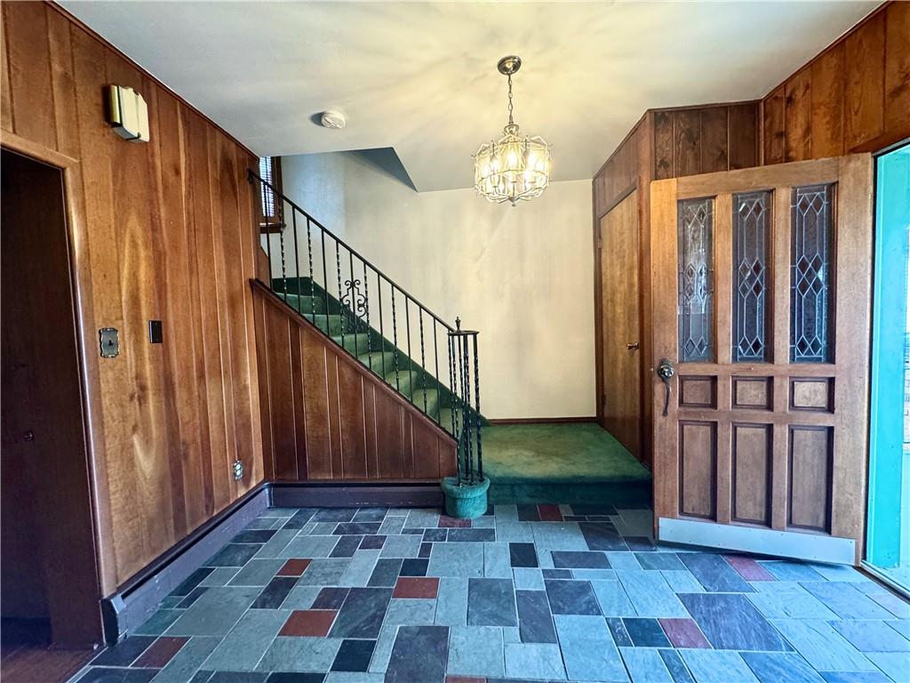 426 Beaver Street Wampum, PA 16157 - Photo 3 of 23 a view of entryway with wooden floor and stairs