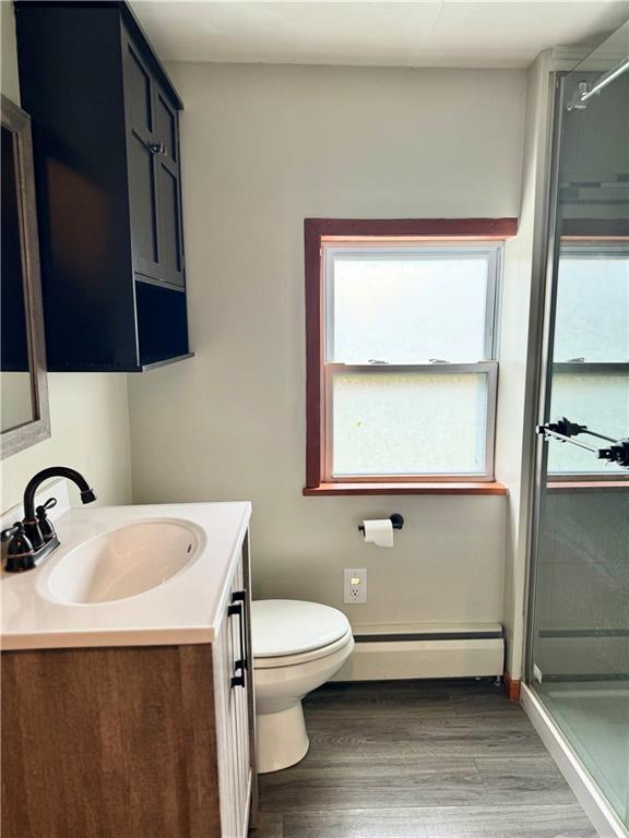 426 Beaver Street Wampum, PA 16157 - Photo 9 of 23 a bathroom with a toilet a sink and mirror