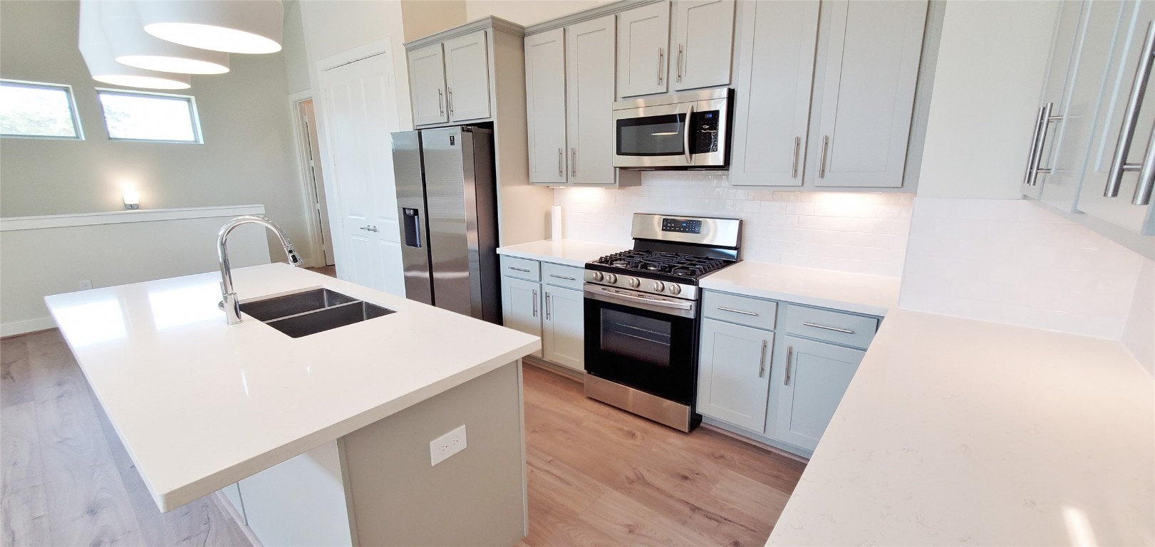 2980 Alice Street Houston, TX 77054 - Photo 5 of 20 a kitchen with a sink a stove and refrigerator