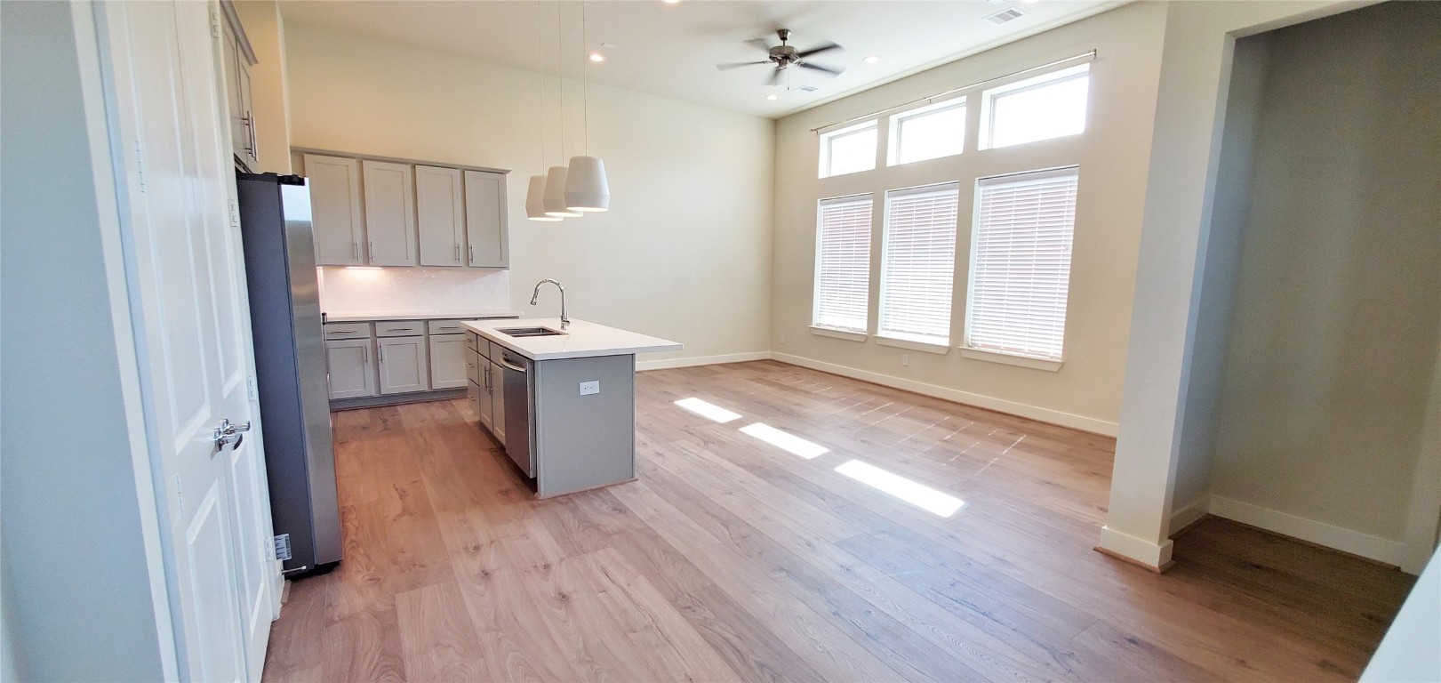 2980 Alice Street Houston, TX 77054 - Photo 7 of 20 a kitchen with stainless steel appliances granite countertop wooden floors and sink