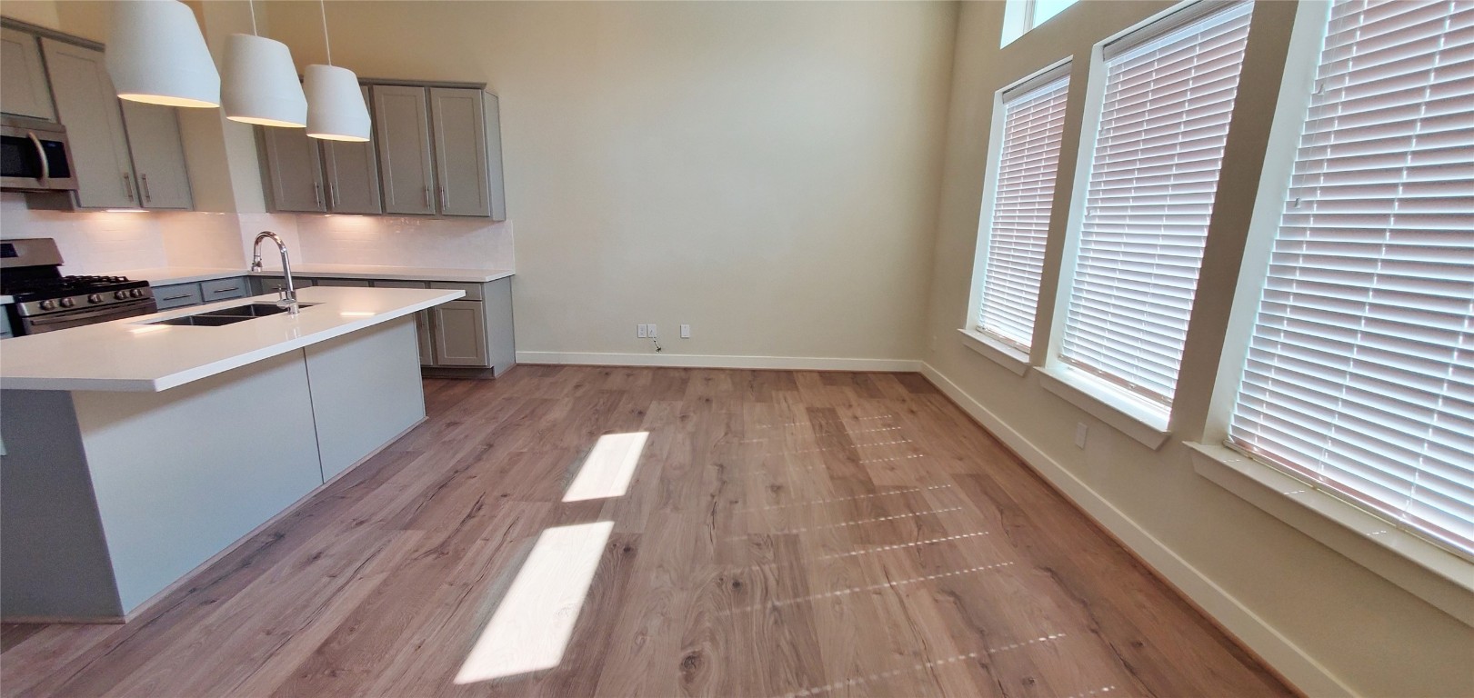 2980 Alice Street Houston, TX 77054 - Photo 8 of 20 a kitchen with wooden floors and a stove