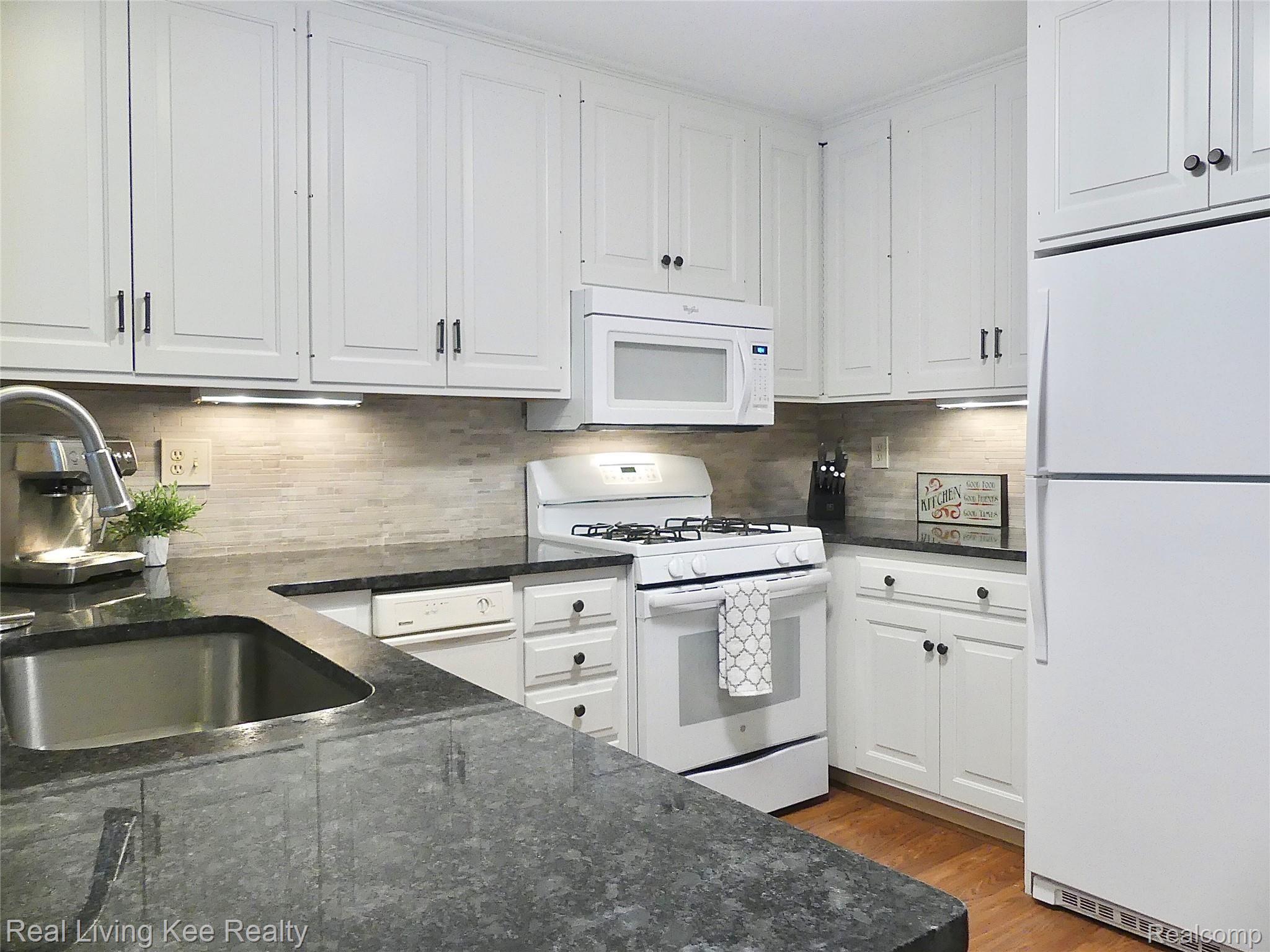 1355 Autumn Lane Rochester, MI 48306 - Photo 12 of 40 Updated kitchen with granite counters, stone backspash