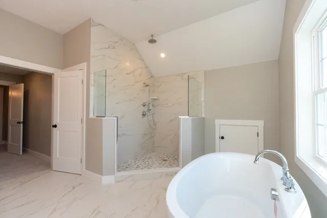 a bathroom with a shower and a sink