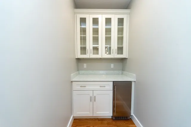 a view of an entryway with wooden floor