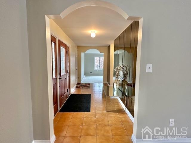 166 Lloyd Road Aberdeen, NJ 07747 - Photo 11 of 56 a bathroom with a tub and shower