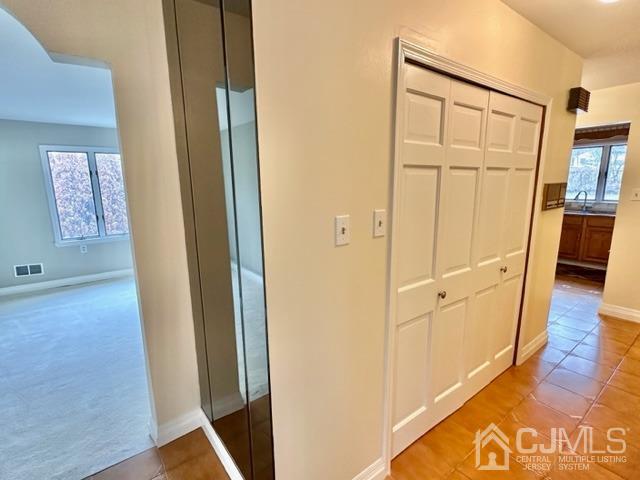 166 Lloyd Road Aberdeen, NJ 07747 - Photo 12 of 56 a view of a hallway with wooden floor