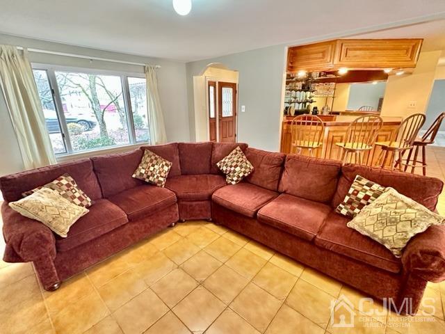 166 Lloyd Road Aberdeen, NJ 07747 - Photo 13 of 56 a living room with a couch and a table