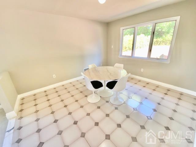 166 Lloyd Road Aberdeen, NJ 07747 - Photo 22 of 56 a view of wooden floor and a window