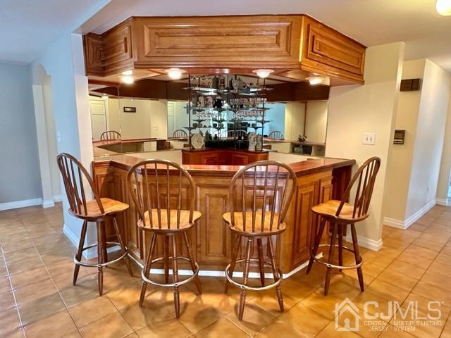 166 Lloyd Road Aberdeen, NJ 07747 - Photo 23 of 56 a view of a dining room with furniture and chandelier