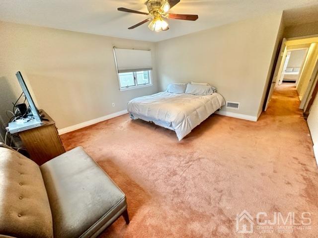 166 Lloyd Road Aberdeen, NJ 07747 - Photo 30 of 56 a bedroom with a bed and a couch