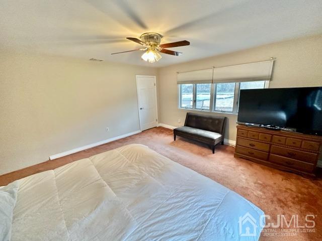 166 Lloyd Road Aberdeen, NJ 07747 - Photo 31 of 56 a living room with furniture and a flat screen tv