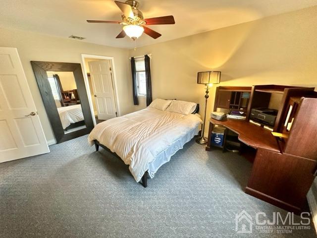 166 Lloyd Road Aberdeen, NJ 07747 - Photo 34 of 56 a spacious bedroom with a bed and wooden floor
