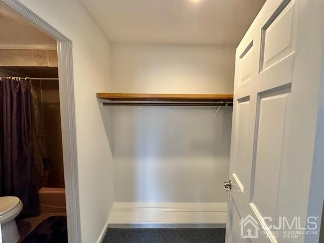 166 Lloyd Road Aberdeen, NJ 07747 - Photo 35 of 56 a bathroom with a shower and a toilet