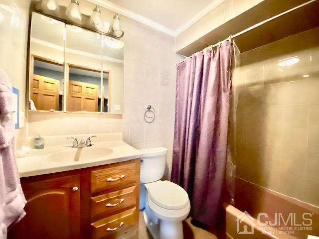 166 Lloyd Road Aberdeen, NJ 07747 - Photo 36 of 56 a bathroom with a sink and a mirror