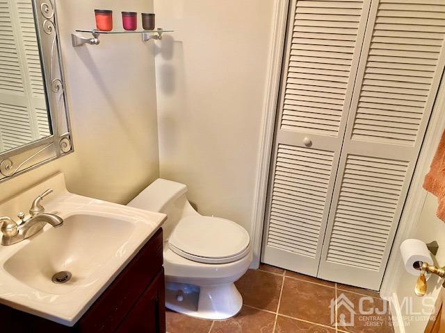 166 Lloyd Road Aberdeen, NJ 07747 - Photo 42 of 56 a bathroom with a sink and a toilet