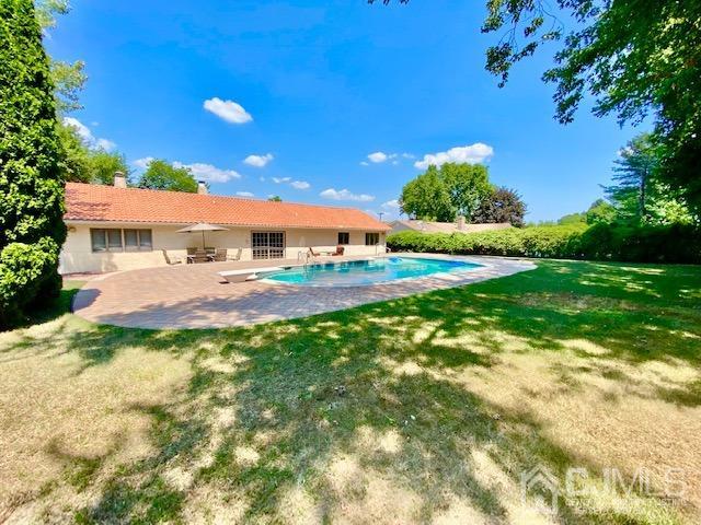 166 Lloyd Road Aberdeen, NJ 07747 - Photo 45 of 56 a view of a backyard with plants and patio