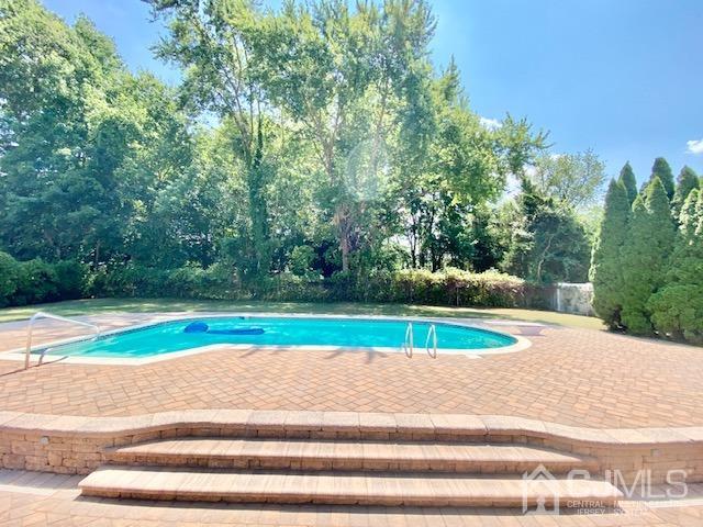 166 Lloyd Road Aberdeen, NJ 07747 - Photo 48 of 56 a view of a yard with large trees