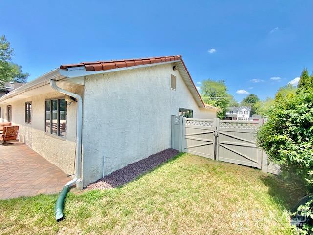 166 Lloyd Road Aberdeen, NJ 07747 - Photo 52 of 56 a front view of a house with a yard