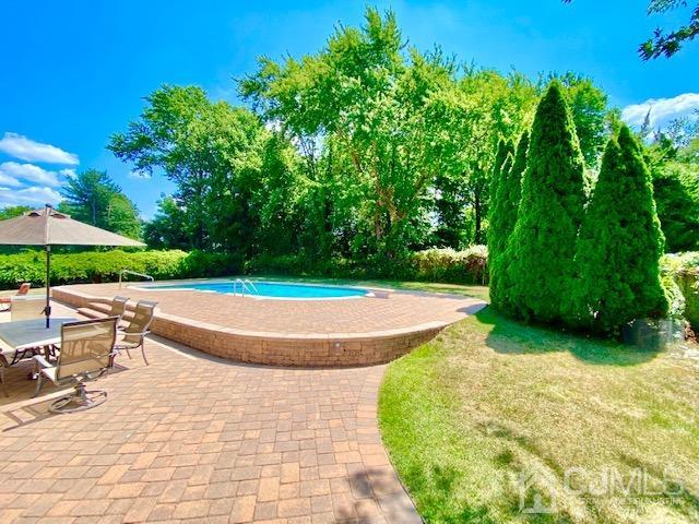 166 Lloyd Road Aberdeen, NJ 07747 - Photo 55 of 56 a view of a swimming pool with a patio