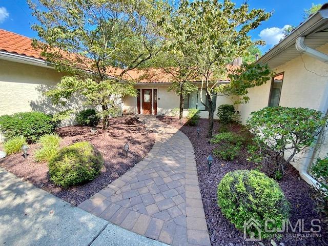 166 Lloyd Road Aberdeen, NJ 07747 - Photo 8 of 56 a front view of a house with a garden