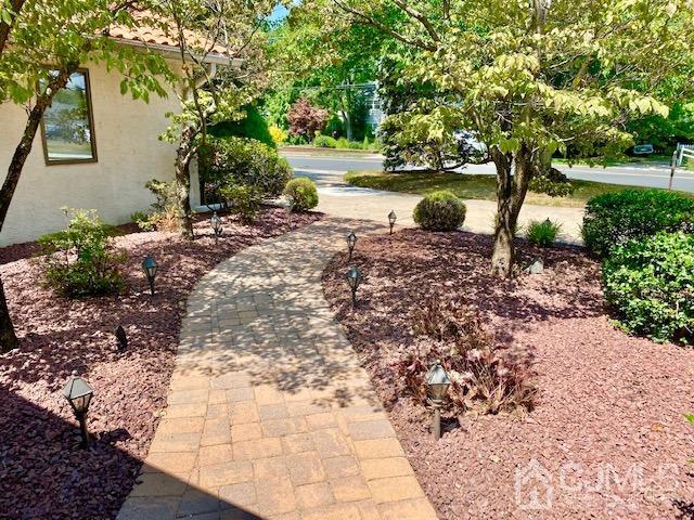 166 Lloyd Road Aberdeen, NJ 07747 - Photo 9 of 56 a backyard of a house with lots of green space