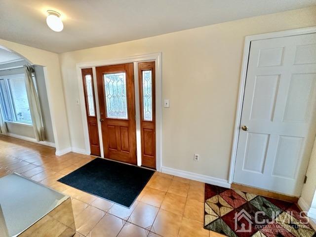 166 Lloyd Road Aberdeen, NJ 07747 - Photo 10 of 56 a view of a bedroom with bed and hallway