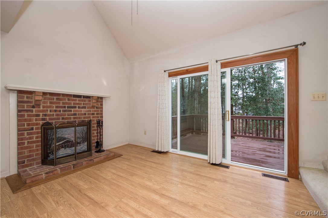 5618 Chatmoss Road Midlothian, VA 23112 - Photo 11 of 25 a view of an empty room with wooden floor fireplace and a window