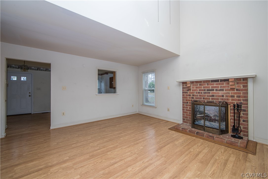 5618 Chatmoss Road Midlothian, VA 23112 - Photo 12 of 25 an empty room with windows and fireplace