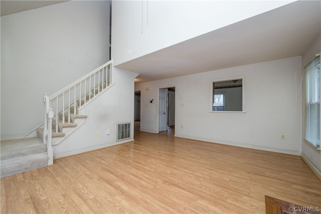 5618 Chatmoss Road Midlothian, VA 23112 - Photo 13 of 25 a view of an empty room with wooden floor and entryway
