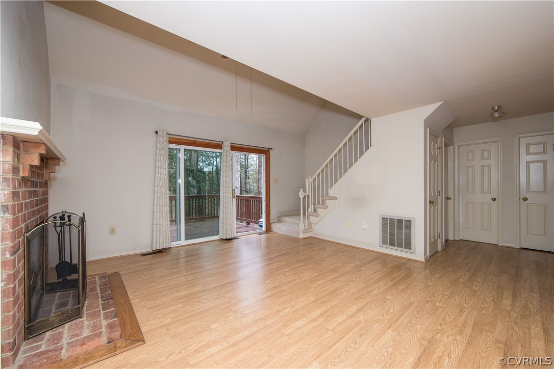 5618 Chatmoss Road Midlothian, VA 23112 - Photo 14 of 25 a view of an empty room with wooden floor and a window
