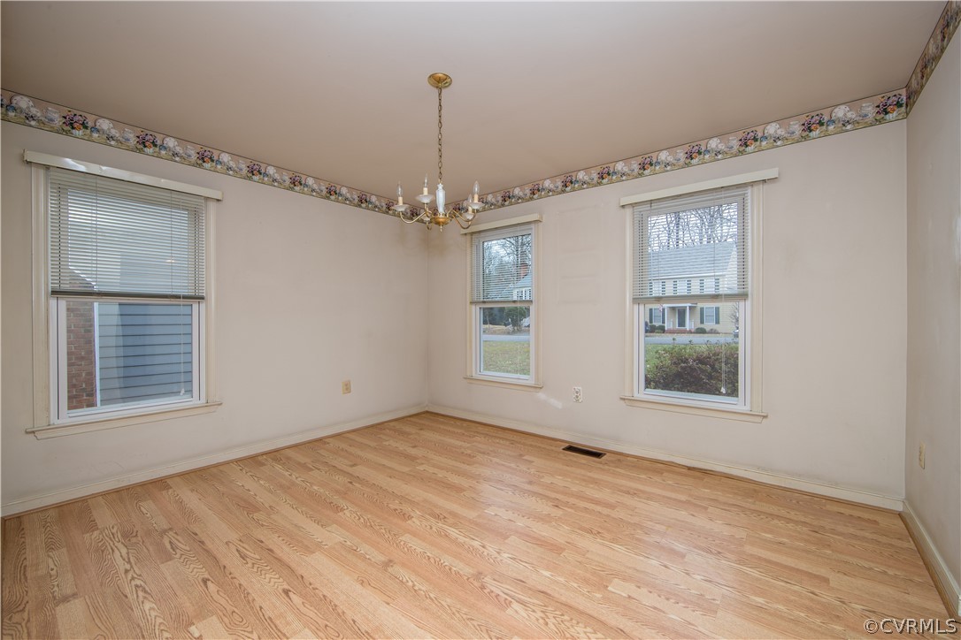 5618 Chatmoss Road Midlothian, VA 23112 - Photo 3 of 25 a view of an empty room with wooden floor and a window