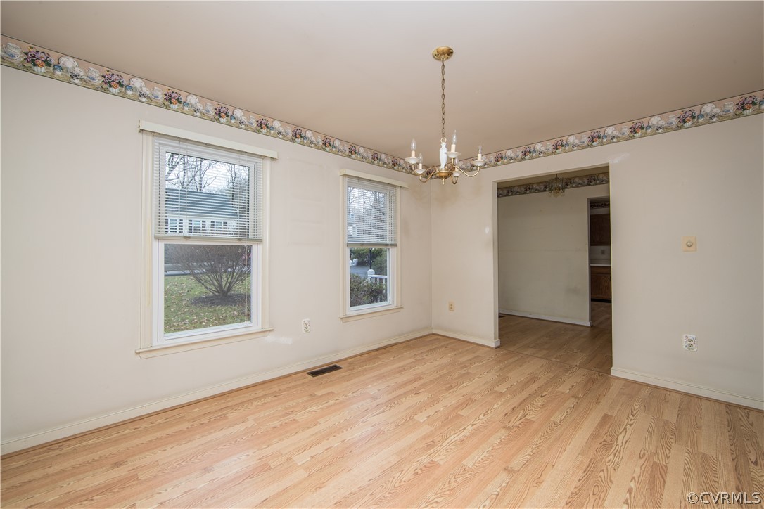 5618 Chatmoss Road Midlothian, VA 23112 - Photo 4 of 25 a view of a big room with wooden floor stairs and a chandelier
