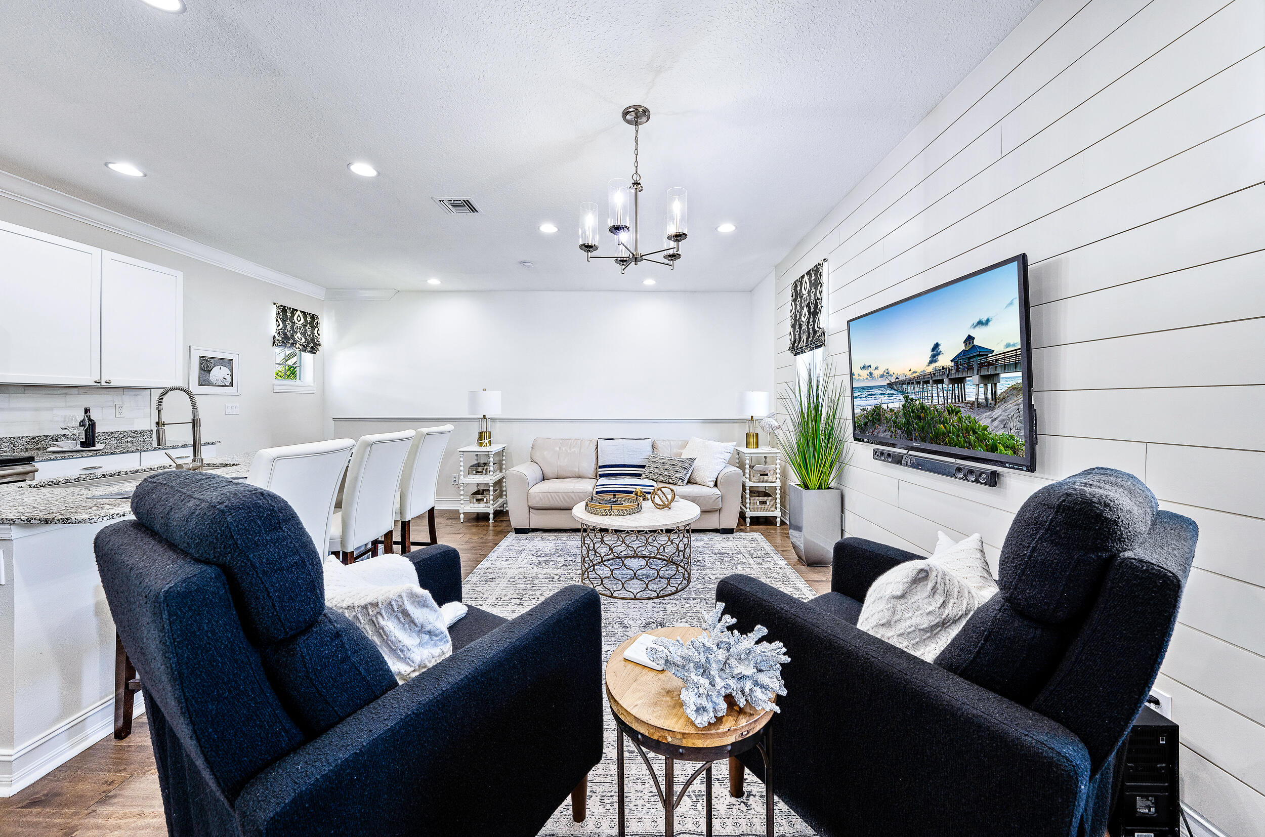 148 Botanica Drive, Unit ADU) Jupiter, FL 33458 - Photo 7 of 14 a living room with furniture and a large window